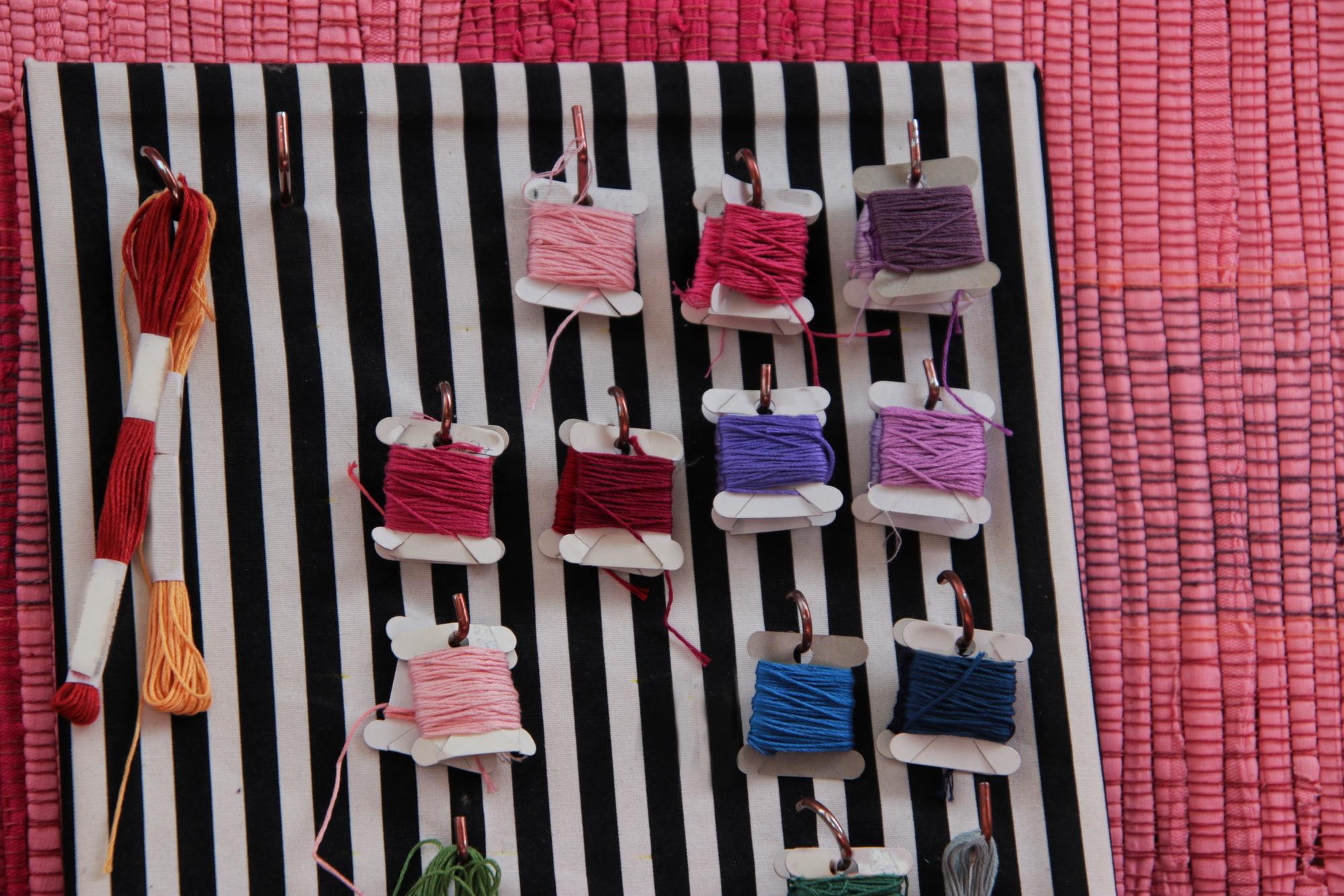Flatlay of embroidered samples and color swatches